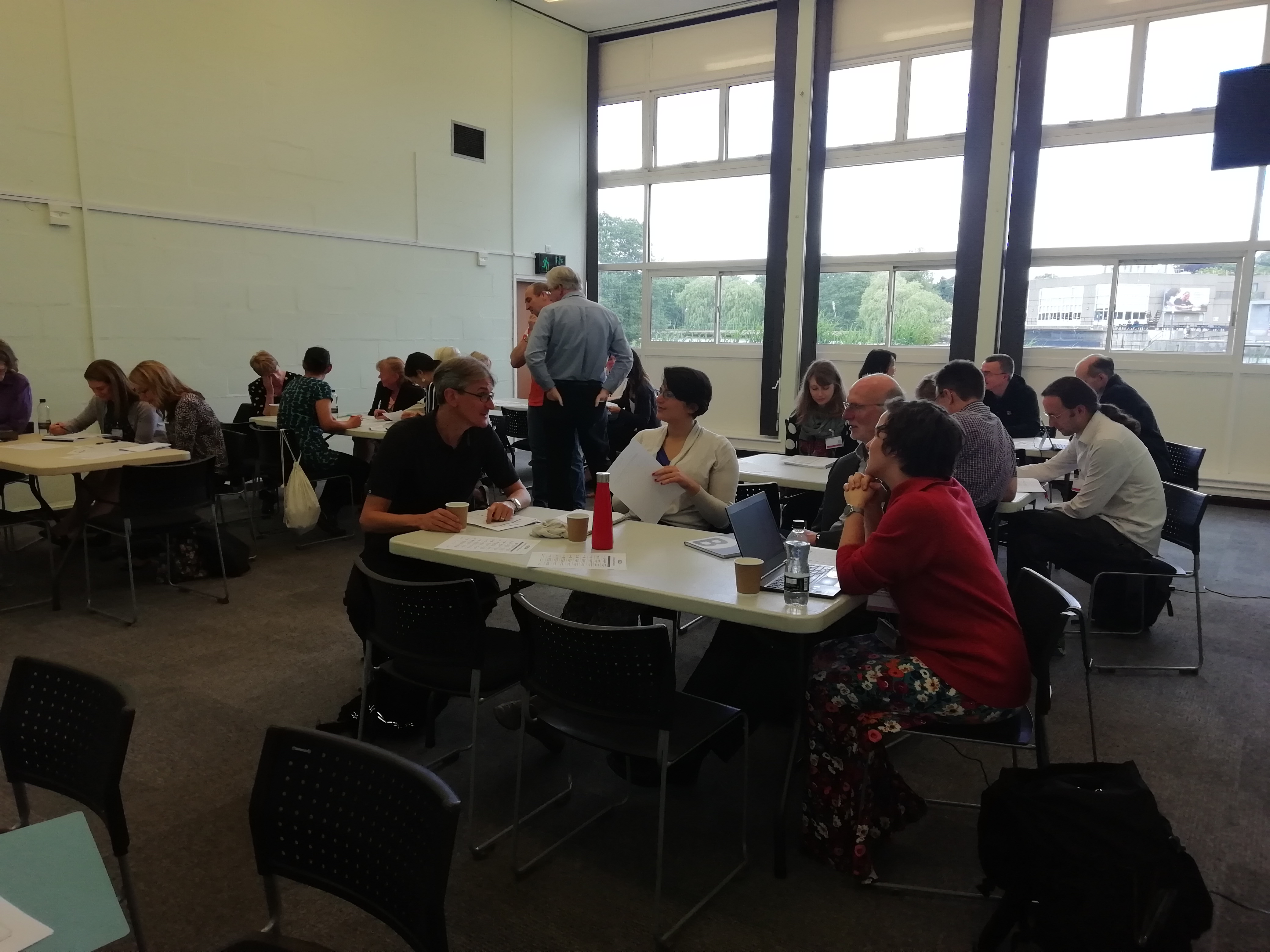 Attendees discussing in groups their most and least preferred Belbin roles