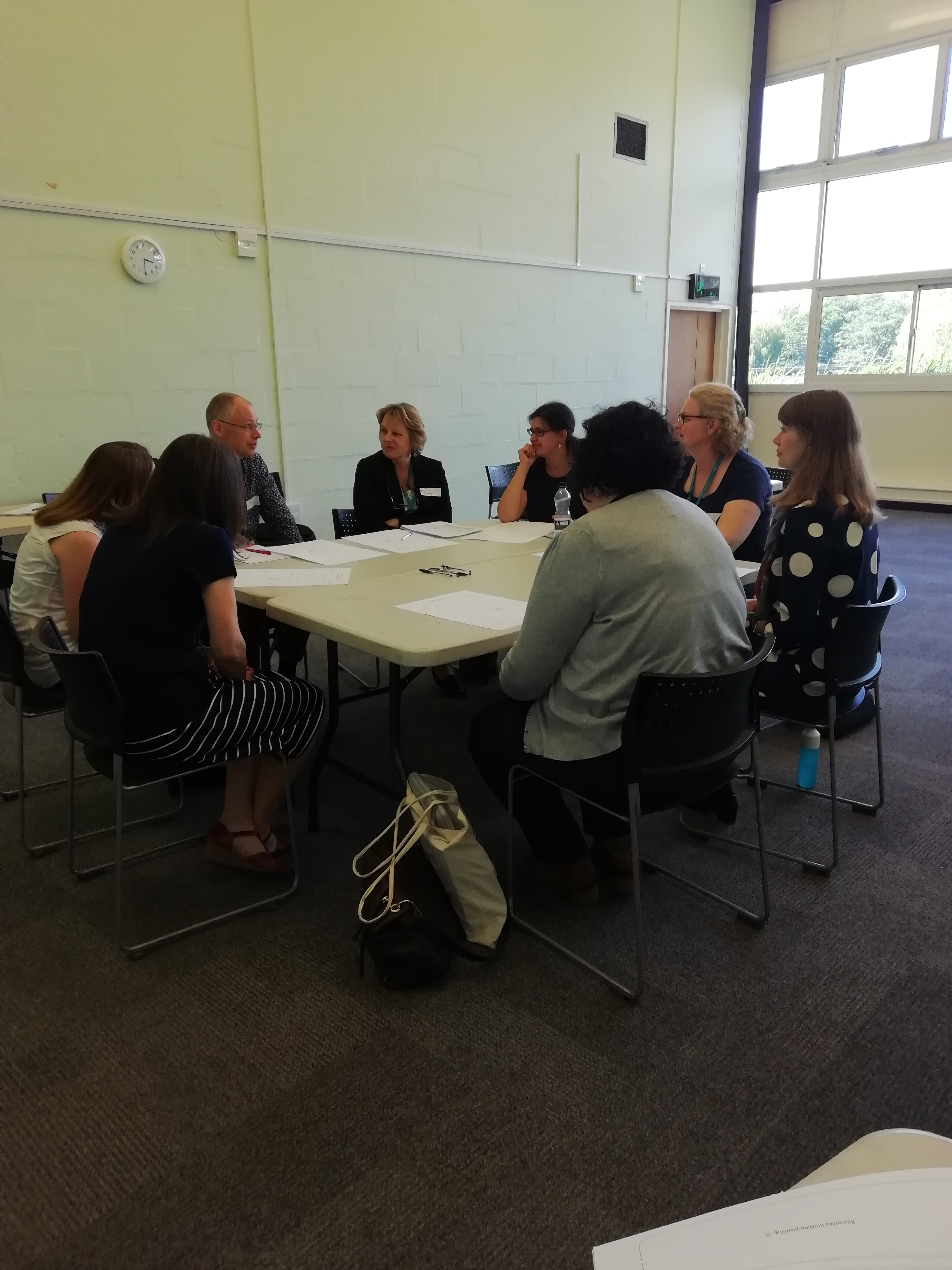 Attendees and the team discussing how IPE can be used in other departments and what the challenges may be.